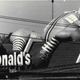 A Ronald McDonald inflatable wilts atop a restaurant franchise location